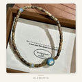 Moonstone & Wood Bracelet — Blue Sphere, Gold-Tone Rings